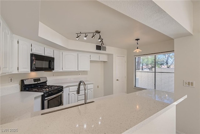 kitchen with light stone countertops, white cabinetry, sink, hanging light fixtures, and stainless steel range with gas stovetop