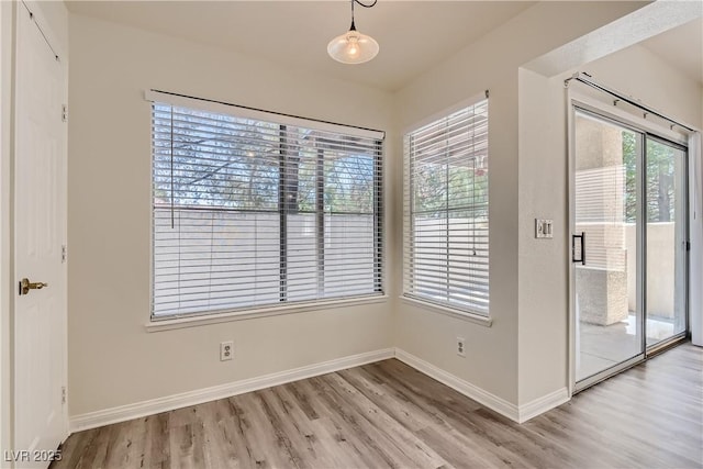 unfurnished room featuring light wood-type flooring