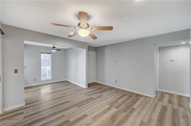 unfurnished room featuring light hardwood / wood-style floors and ceiling fan