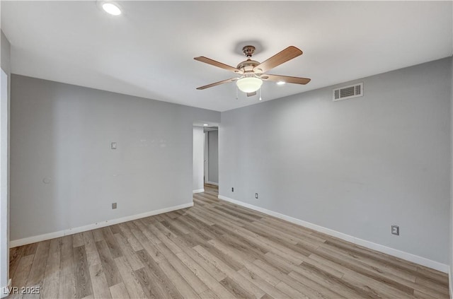 unfurnished room with ceiling fan and light hardwood / wood-style flooring