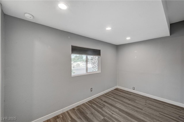 unfurnished room featuring hardwood / wood-style flooring