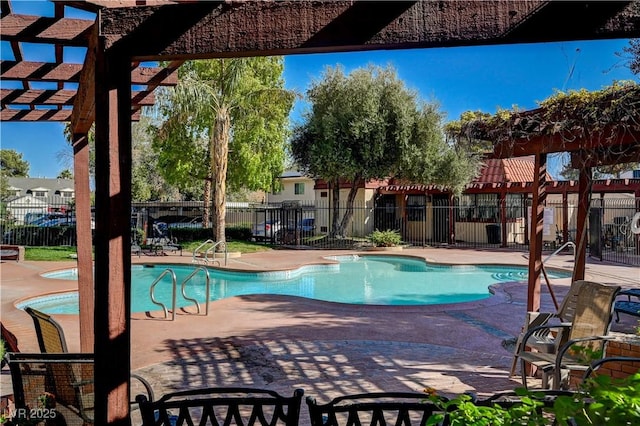 view of swimming pool featuring a jacuzzi, a patio, and a pergola