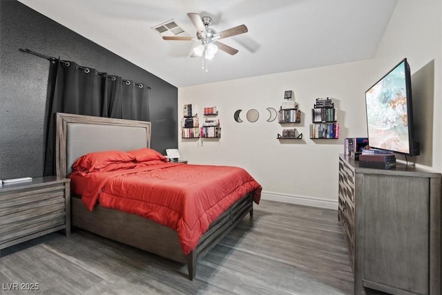 bedroom featuring hardwood / wood-style flooring and ceiling fan