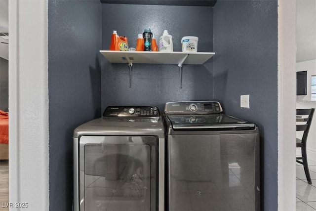 laundry room with light tile patterned floors and independent washer and dryer