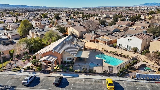 birds eye view of property featuring a mountain view