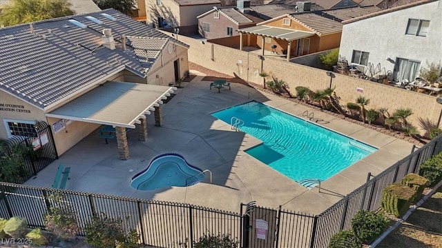 view of swimming pool featuring a patio area