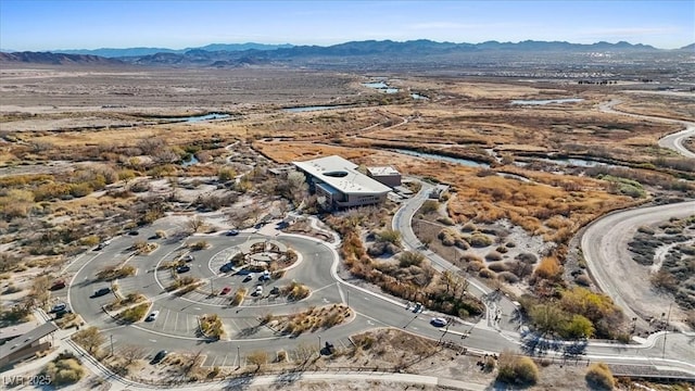 birds eye view of property featuring a mountain view