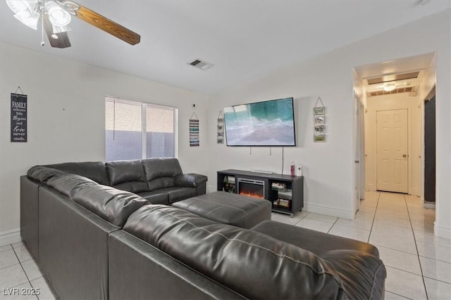 living room featuring ceiling fan and light tile patterned floors