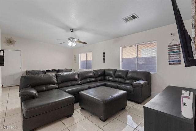 tiled living room featuring ceiling fan