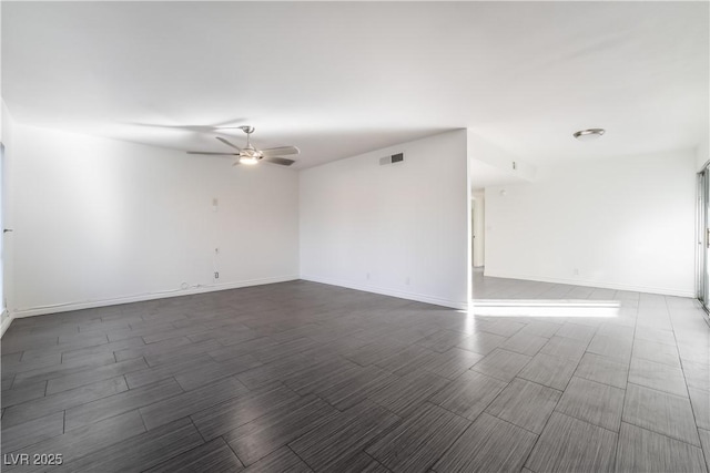 unfurnished room with ceiling fan