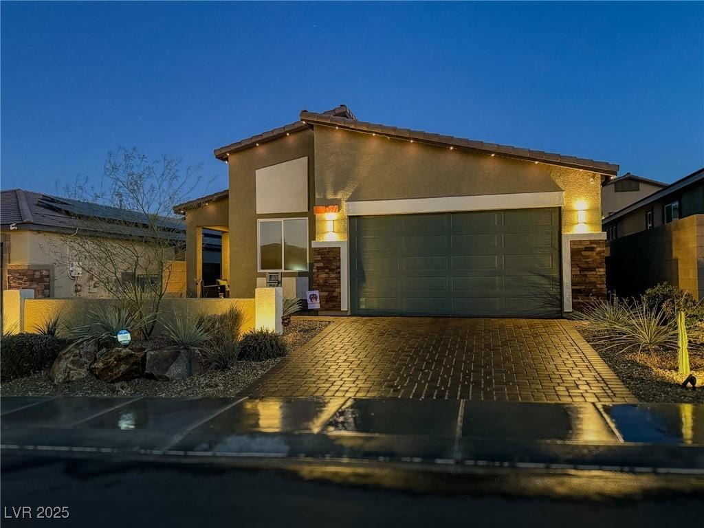 view of front of property with a garage