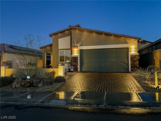 view of front of property with a garage