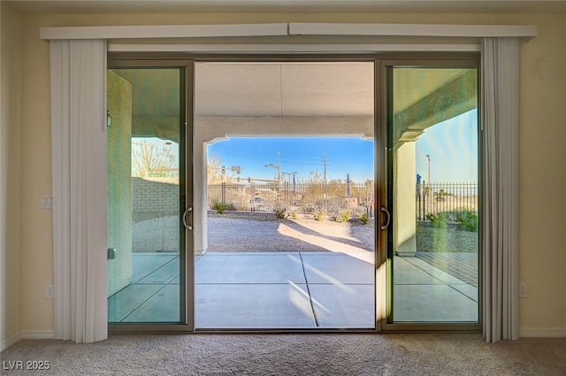 entryway with carpet floors