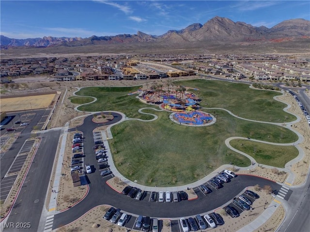 birds eye view of property featuring a mountain view