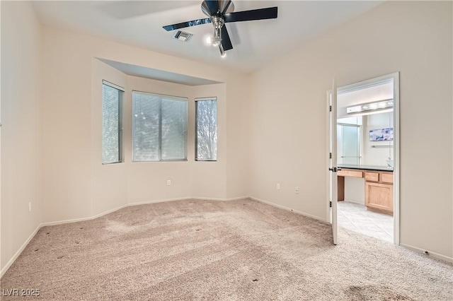 carpeted empty room with ceiling fan