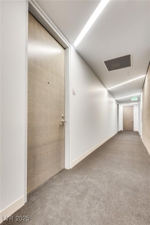 hallway featuring carpet flooring