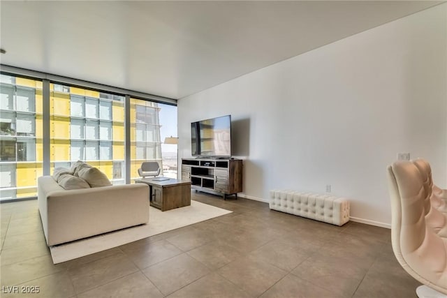 living room featuring expansive windows and tile patterned floors