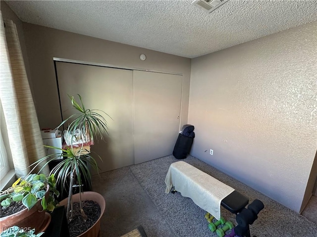 interior space with a textured ceiling