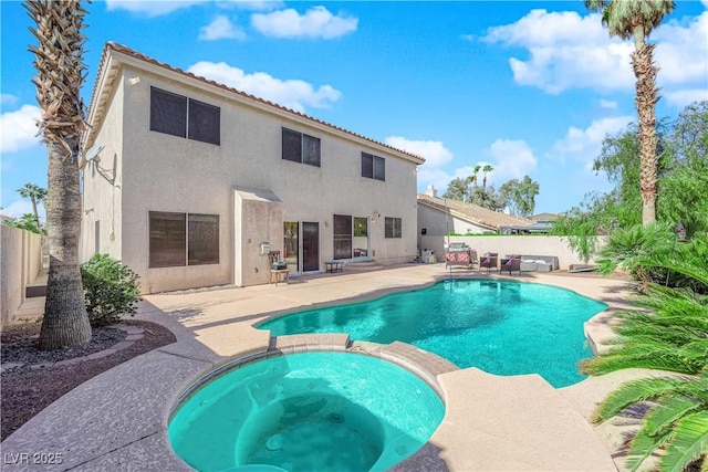 view of pool with an in ground hot tub and a patio area