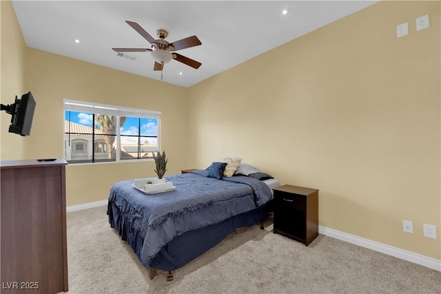 bedroom with ceiling fan and light colored carpet