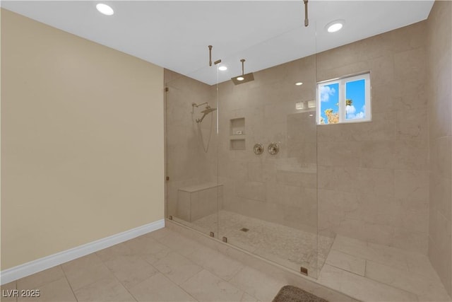 bathroom with a tile shower