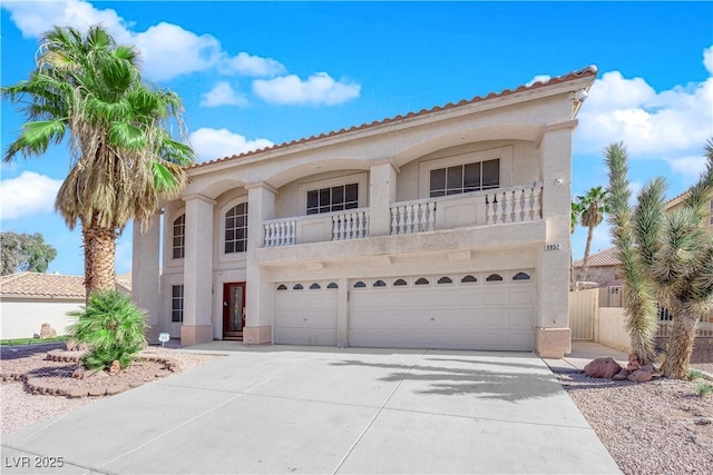 mediterranean / spanish house with a garage