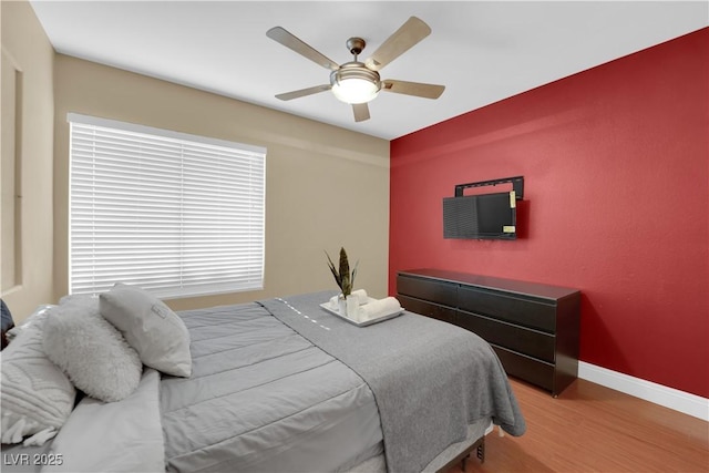 bedroom featuring ceiling fan and light hardwood / wood-style floors