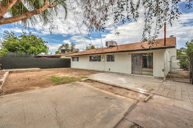 back of house featuring a patio