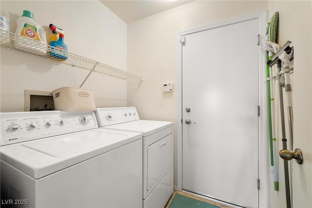 clothes washing area with washer and dryer