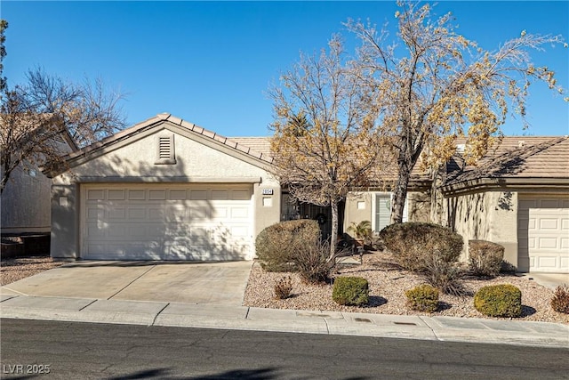 ranch-style home featuring a garage