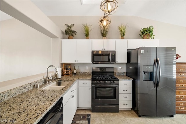 kitchen featuring sink, white cabinets, decorative light fixtures, and stainless steel appliances