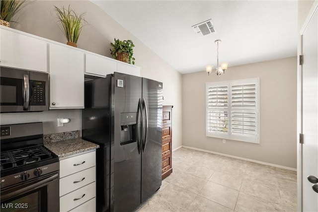 kitchen featuring white cabinets, pendant lighting, and appliances with stainless steel finishes