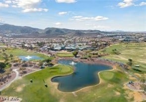 bird's eye view with a water and mountain view