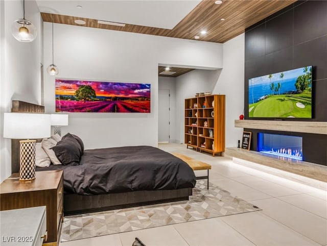 bedroom featuring light tile patterned floors and wood ceiling