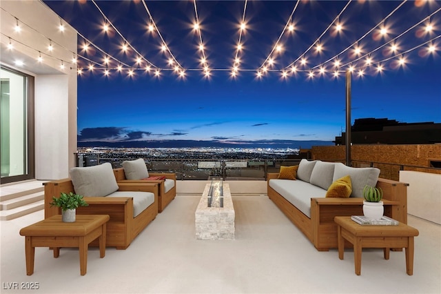 patio terrace at dusk featuring outdoor lounge area