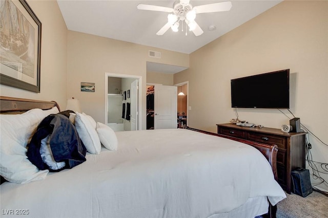 carpeted bedroom featuring ceiling fan and ensuite bathroom