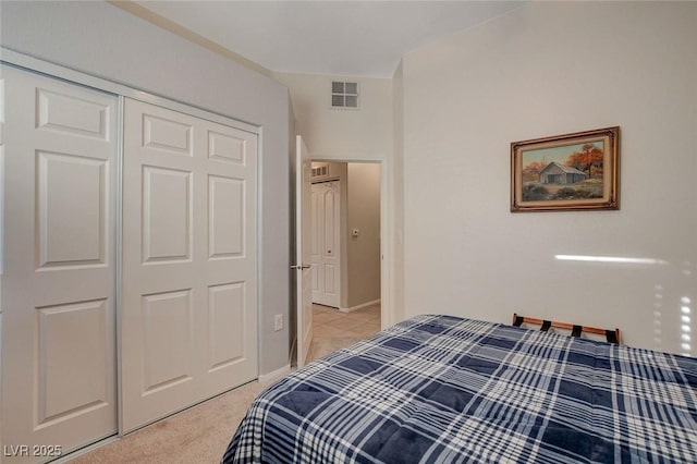 carpeted bedroom featuring a closet