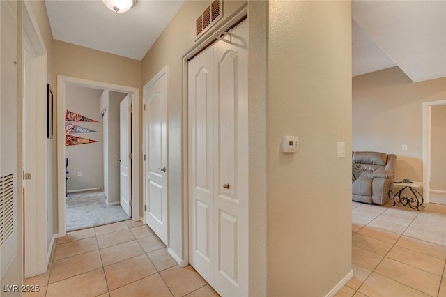 hall with light tile patterned flooring