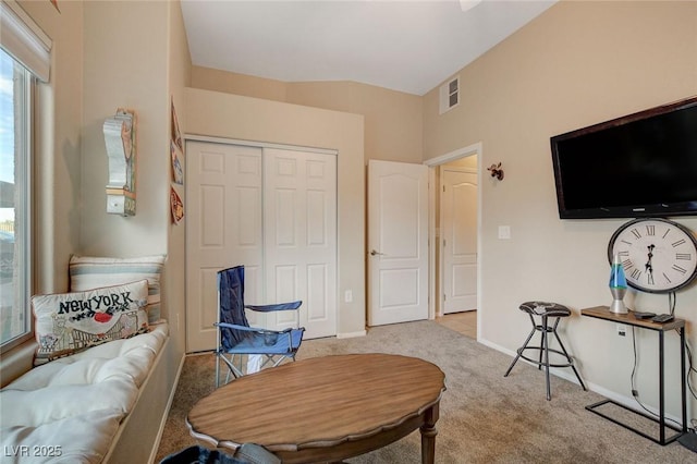 living area featuring light colored carpet