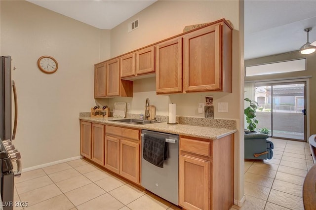 kitchen with sink, dishwasher, light tile patterned floors, and pendant lighting