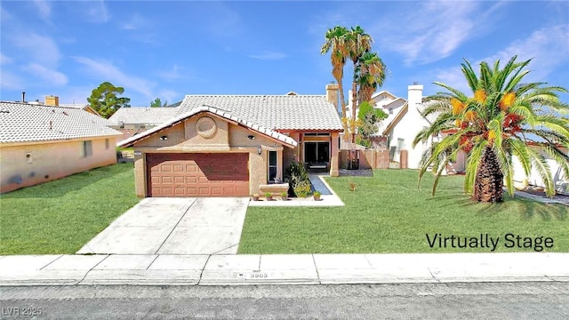 view of front of house featuring a garage, driveway, a front yard, and a tile roof