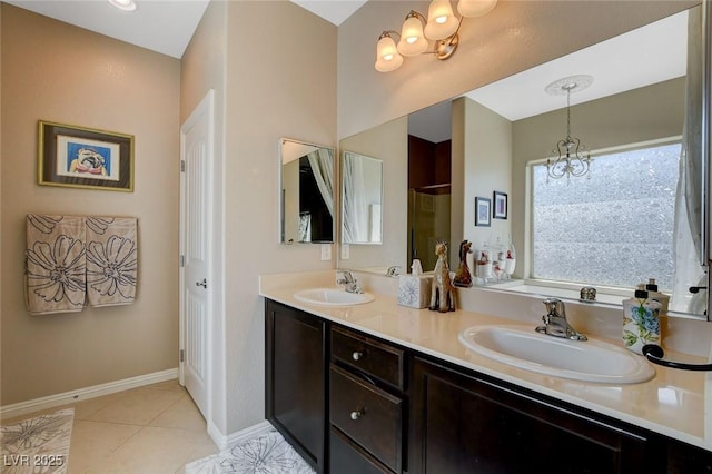 bathroom featuring an inviting chandelier, a shower, tile patterned floors, and vanity