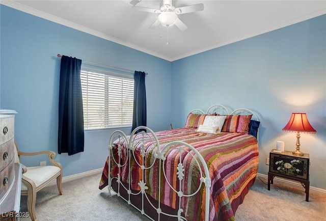 carpeted bedroom with crown molding and ceiling fan