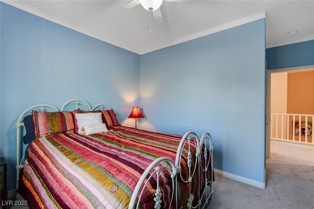 bedroom featuring ceiling fan, carpet, and crown molding