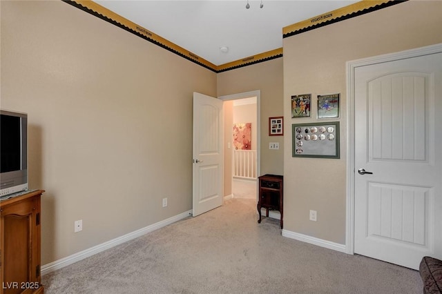 unfurnished bedroom featuring ornamental molding and light carpet