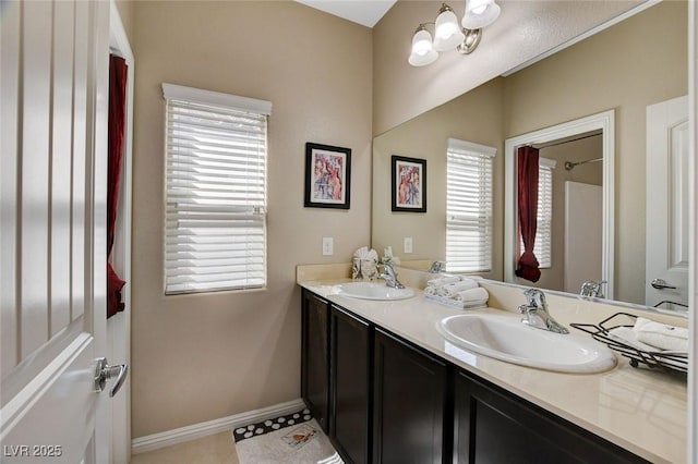 bathroom featuring vanity, tile patterned floors, and plenty of natural light