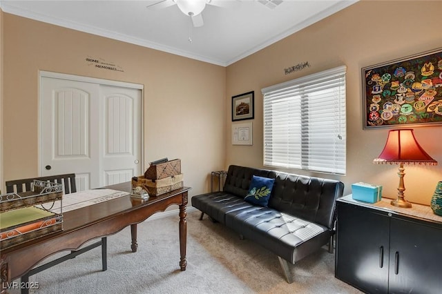 carpeted office with ceiling fan and ornamental molding