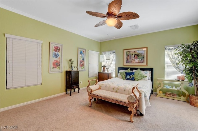 carpeted bedroom with ceiling fan, crown molding, and multiple windows