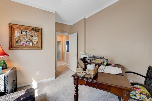 carpeted home office featuring crown molding