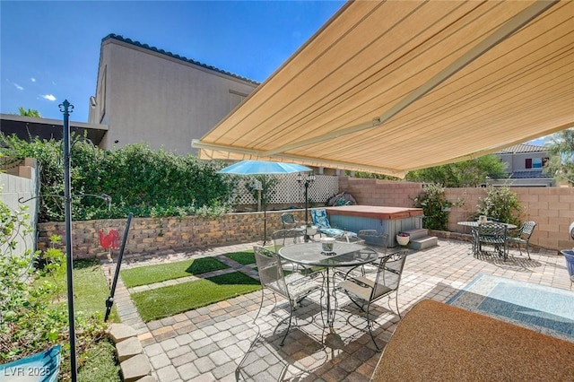 view of patio with a hot tub